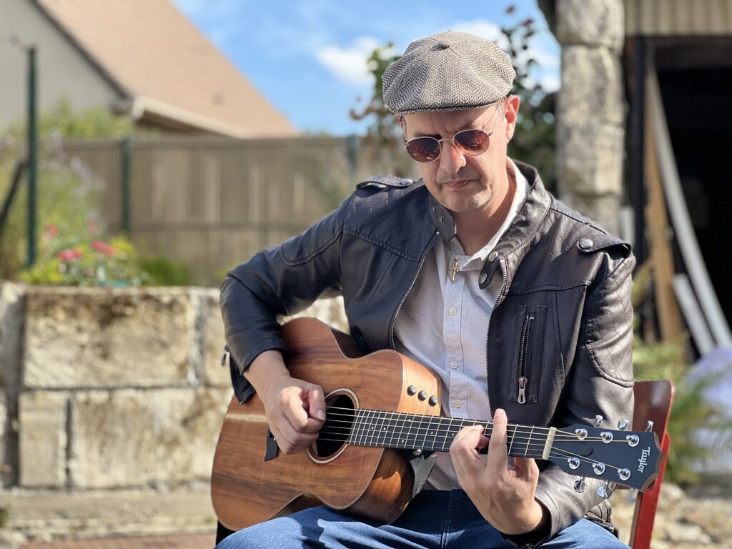 Romain Gutsy with a guitar